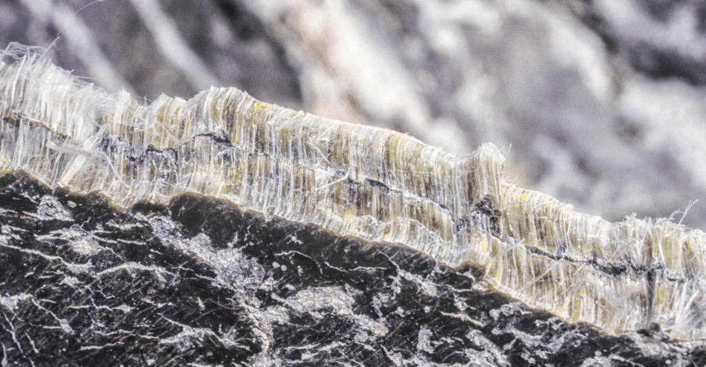 Close-up of asbestos mineral fibres with Agon Environmental logo